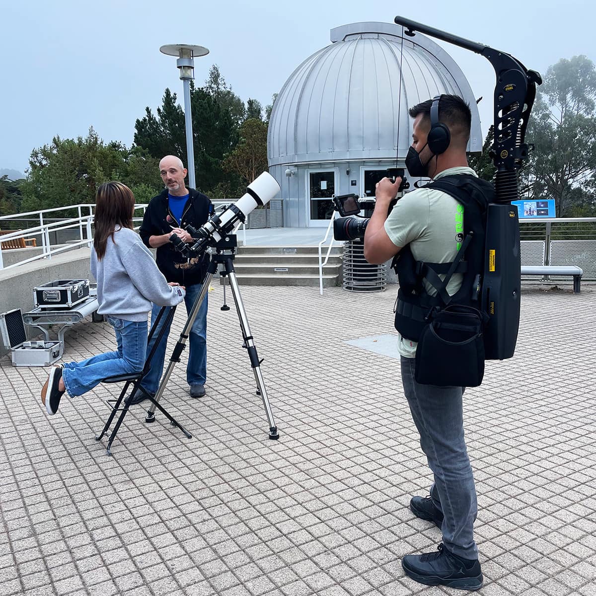Edgar Garcia filming on location with a mask.